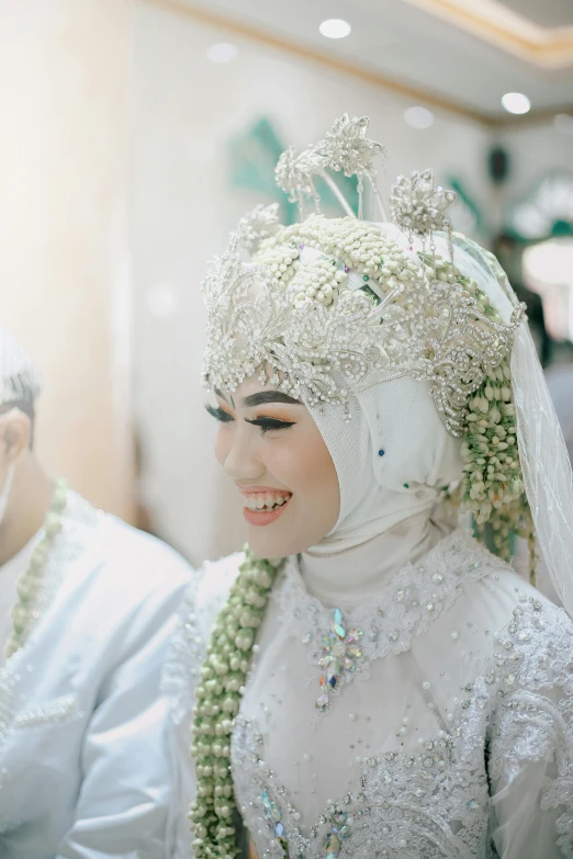 an oriental wedding with an elaborately designed headpiece