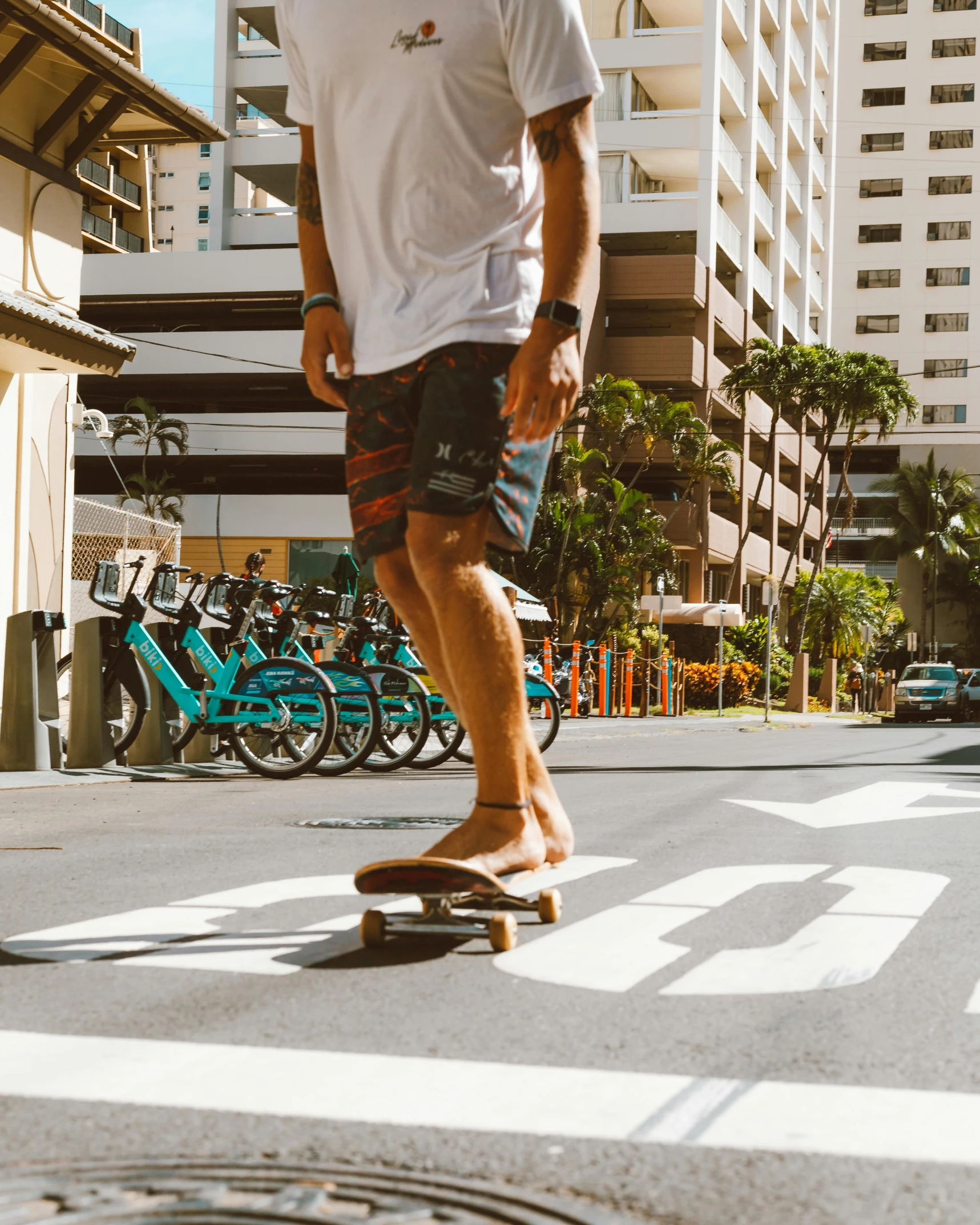 a man is skateboarding across the city street