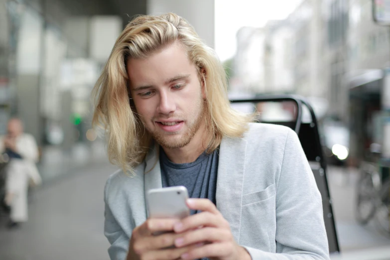 a man looking at his cell phone