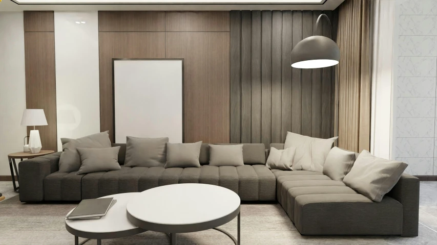 a living room with grey couches and pillows