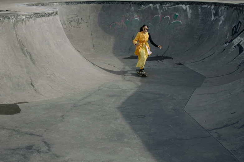 a man rides a skateboard on the cement