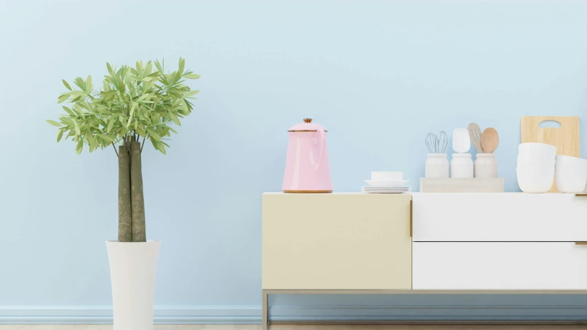 a vase on the floor next to a white cabinet