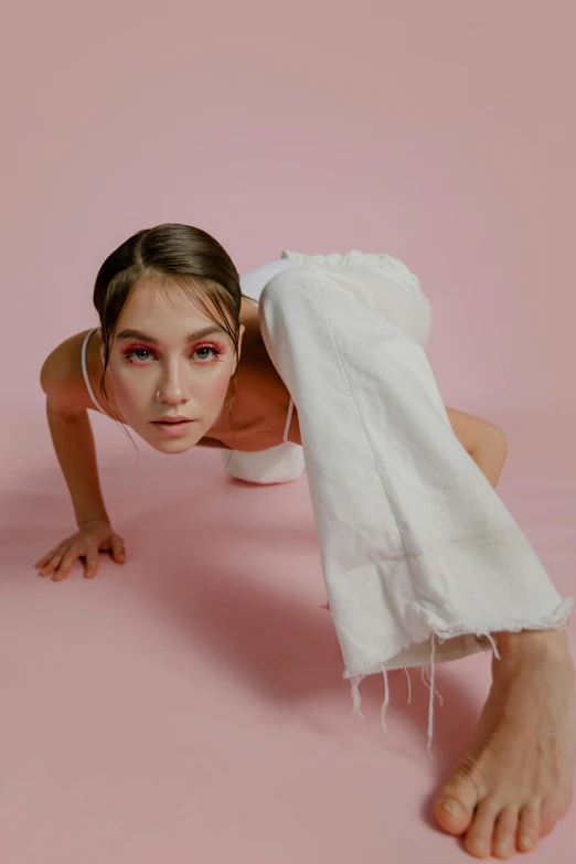 a woman is posing under the blanket for the camera