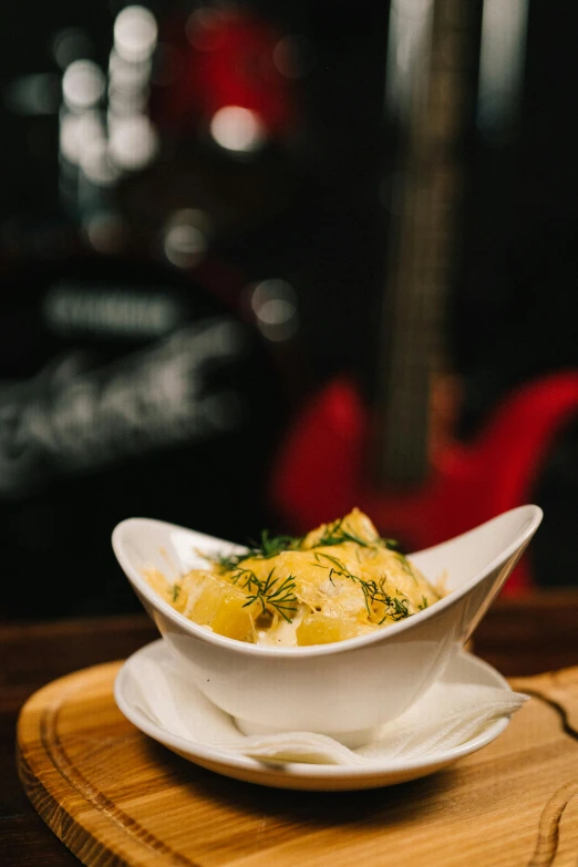 a plate of food sits on a wooden surface