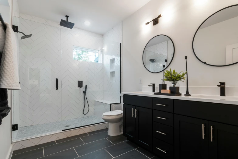 a walk in shower sitting next to a white toilet