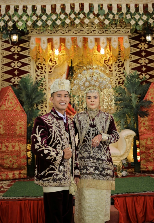 two men standing in front of an elaborate altar