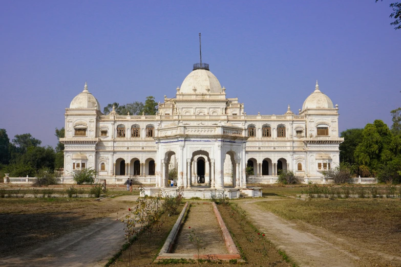 this large building has a long front lawn