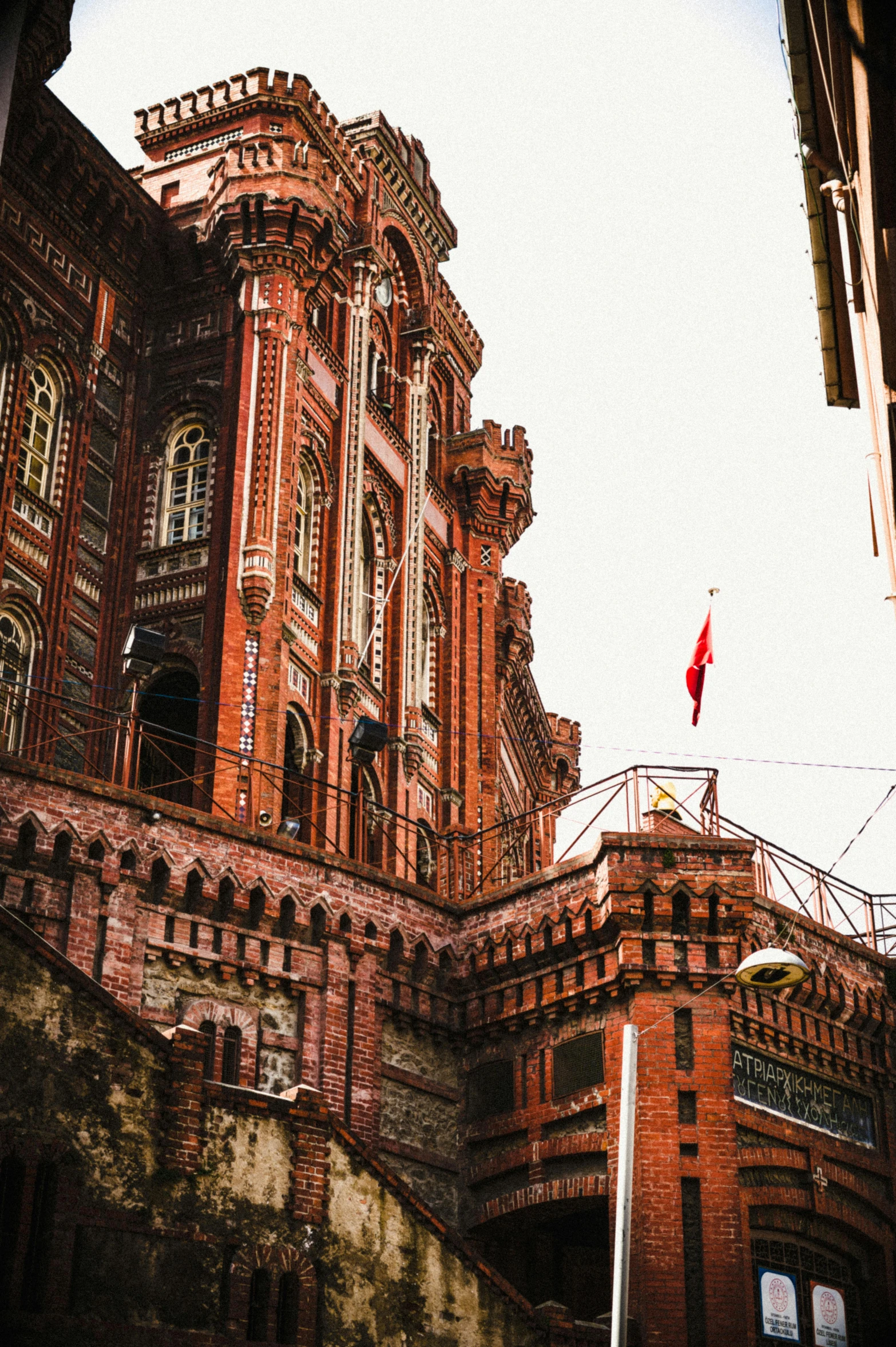 a view of a red building on the street