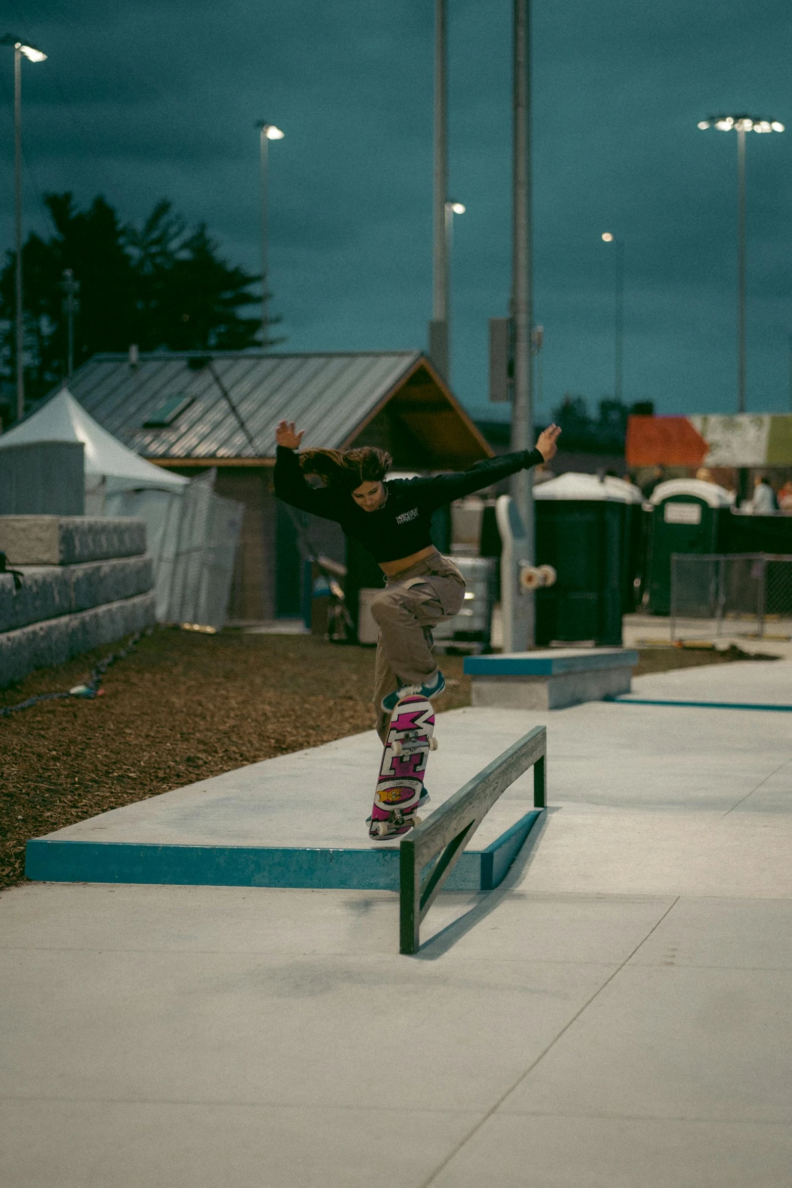 a young skateboarder jumping over the edge of a rail