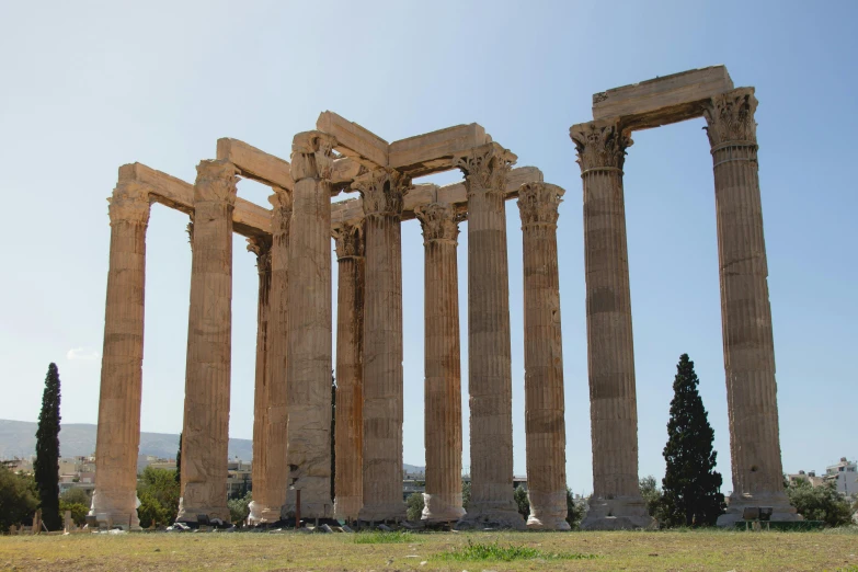 stone columns with trees in the background