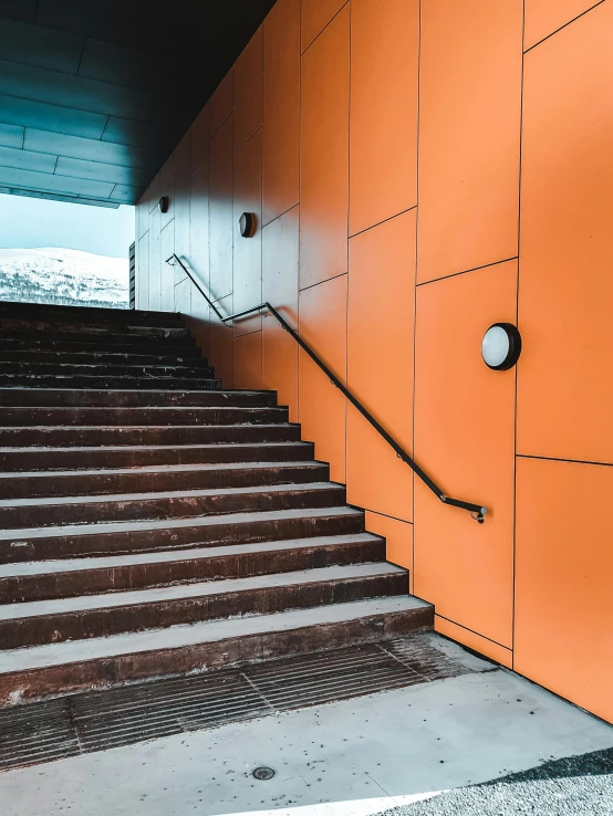 the orange metal stairs and steps are painted orange