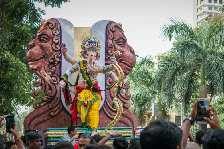 a giant statue of lord ganots and the goddess on display