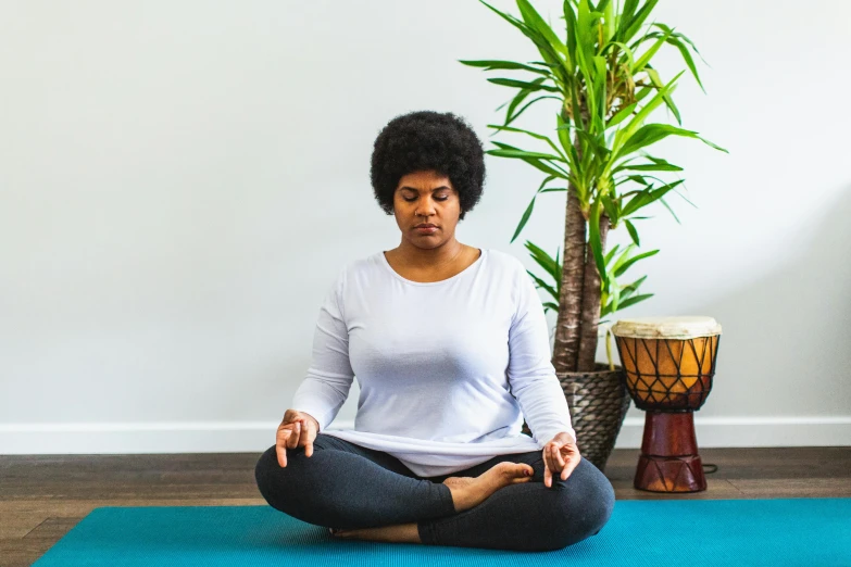 an image of a woman meditating in yoga pose