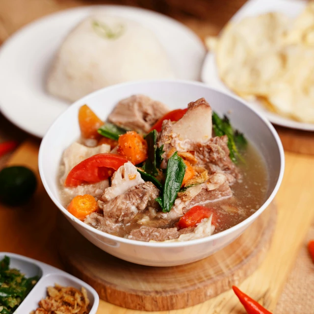 a close up of a bowl of food on a table