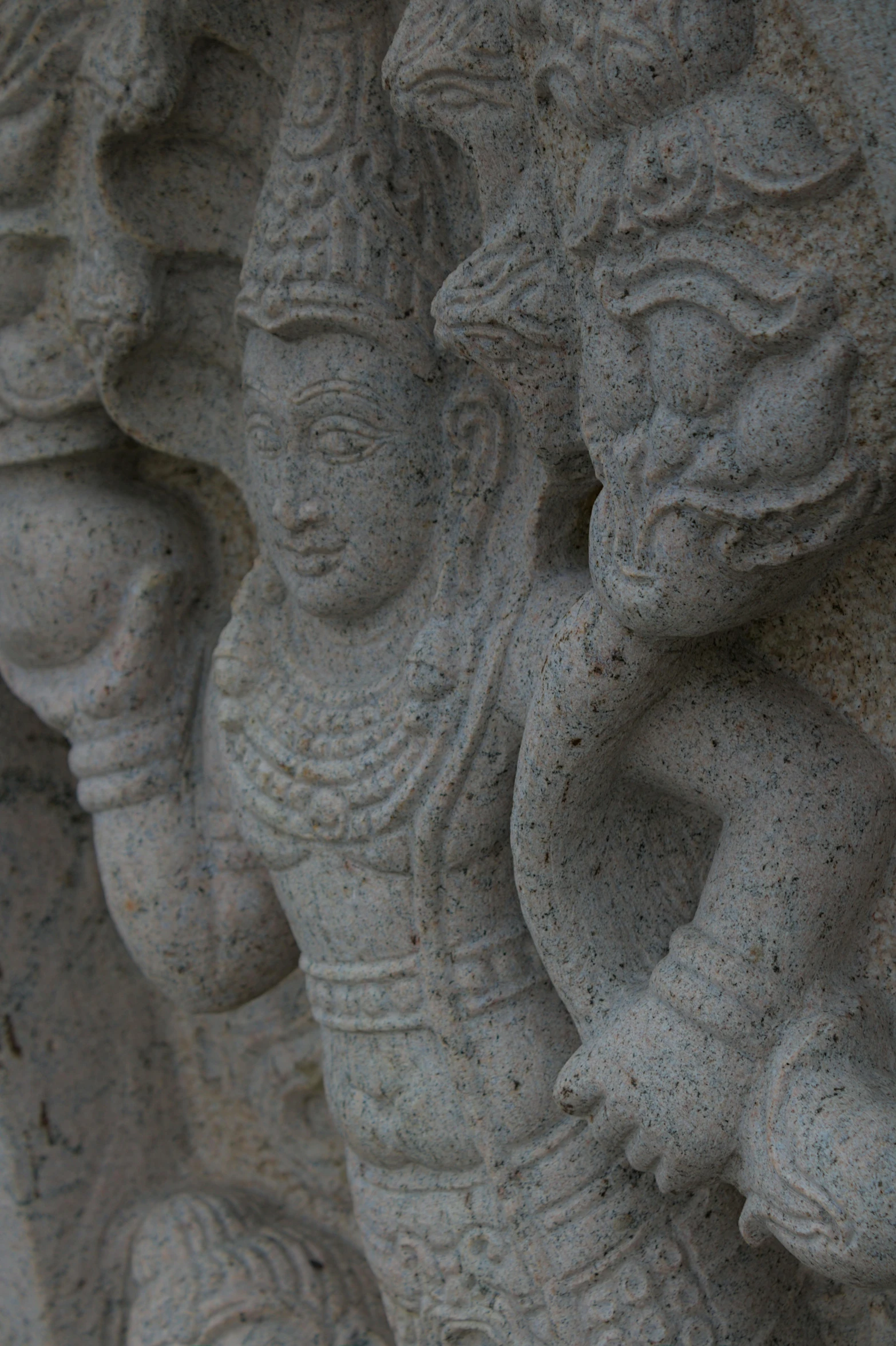 close up of the statue of elephants and person's head