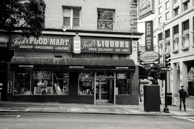 a black and white po of the front of an liquor store