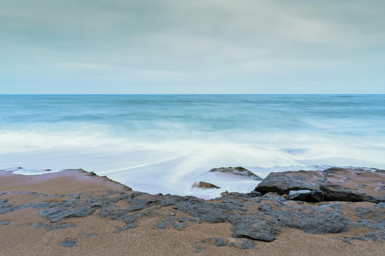 a very pretty view of some kind of wave by the ocean