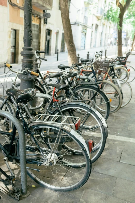 there are many bicycles parked together on the street