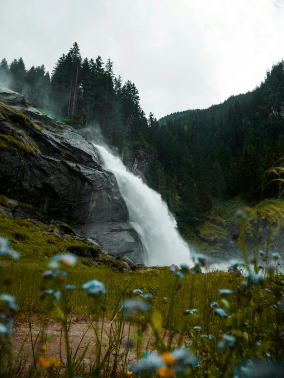 a mountain is next to a stream of water