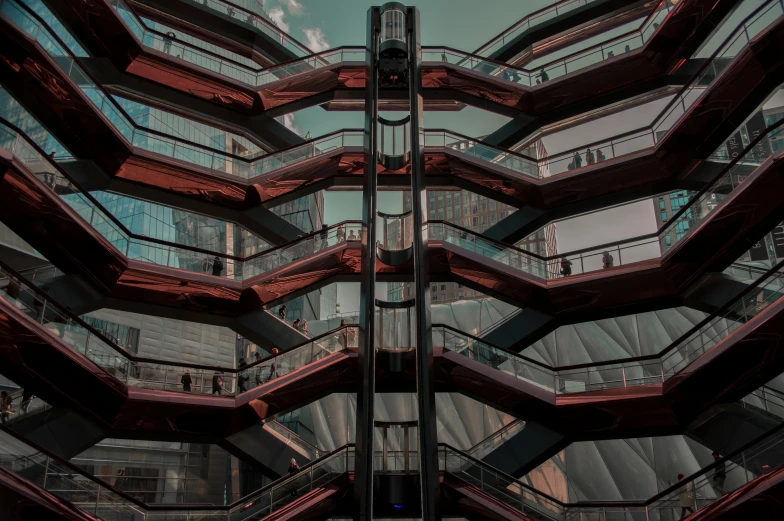 the inside of a glass and metal building with many balconies