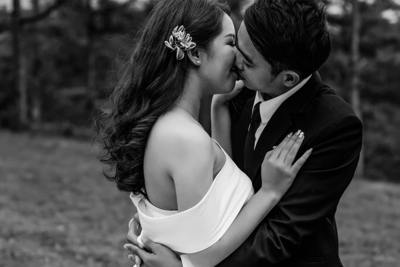 black and white po of young couple kissing