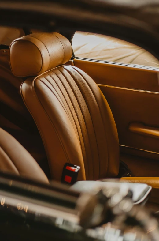 the inside of a luxury car is brown