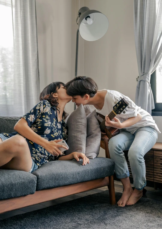 two women in a living room with couches