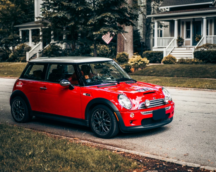 a mini cooper parked on the side of a road