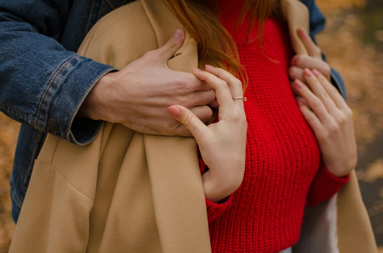 a woman with her hands on her chest