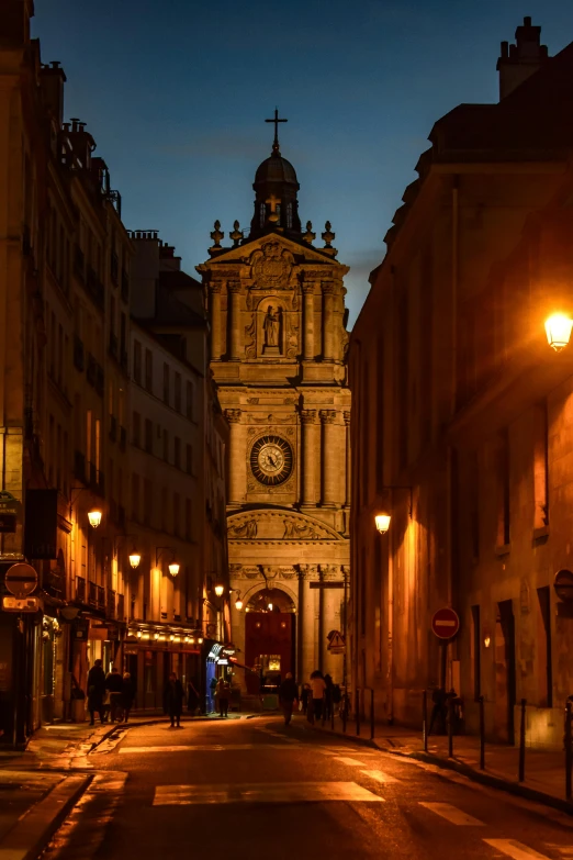 people walking around in a city at night