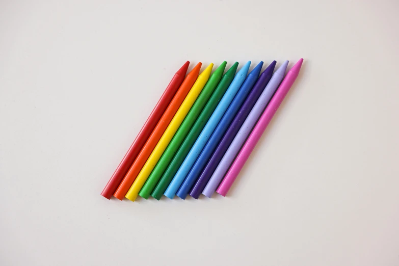 colorful straws laid out on a white table