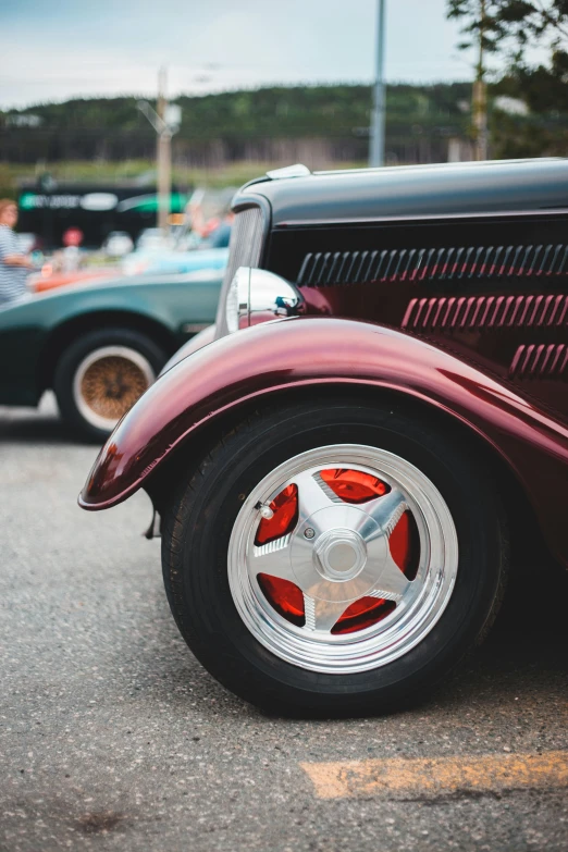 a close up of the front end of a classic car