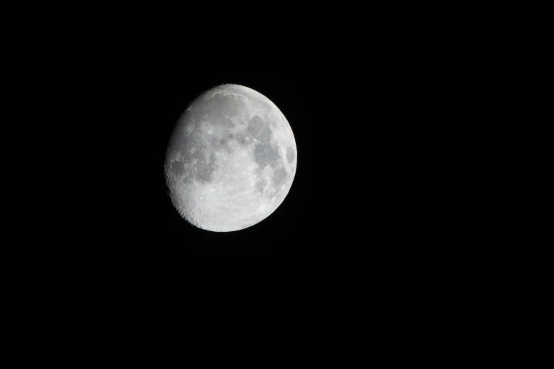 the moon is showing in the night sky