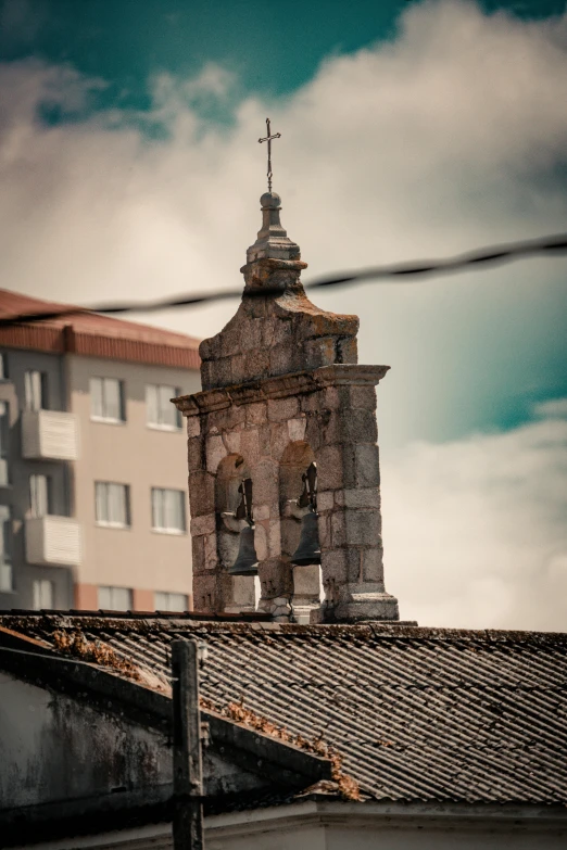 a church steeple with a cross on top