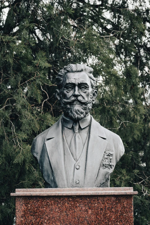 a statue of a man wearing a blazer and tie