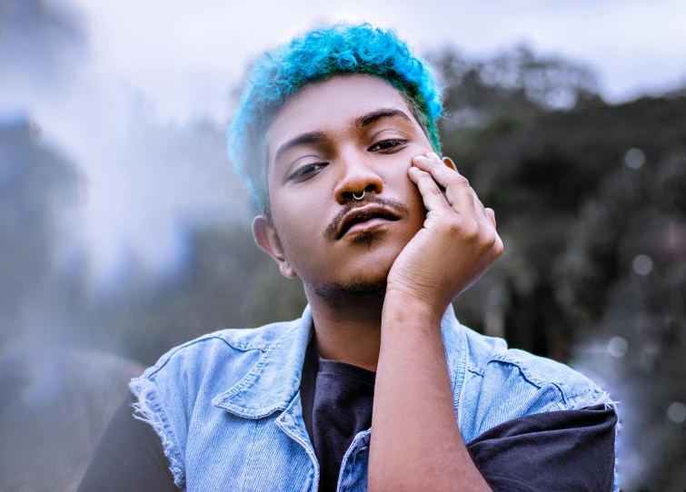 a close up of a person with a blue hair