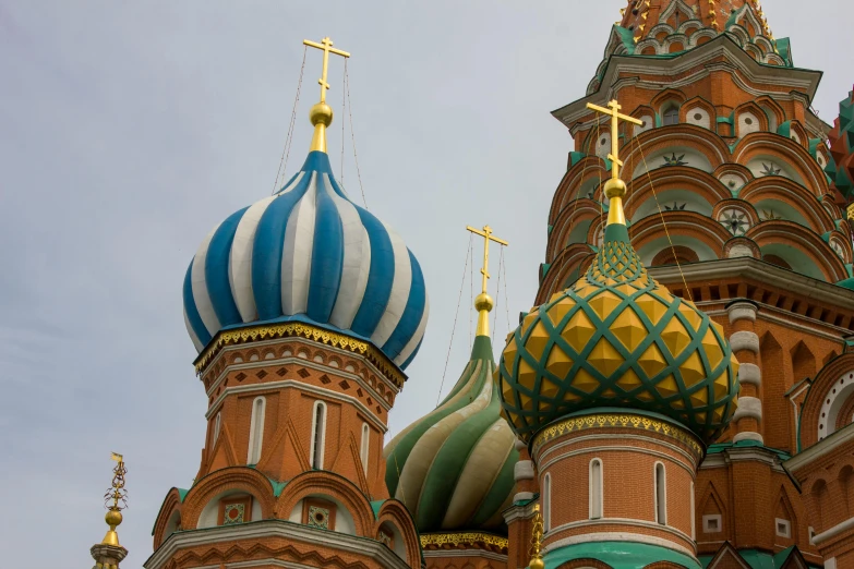 two domes and crosses on top of an old church