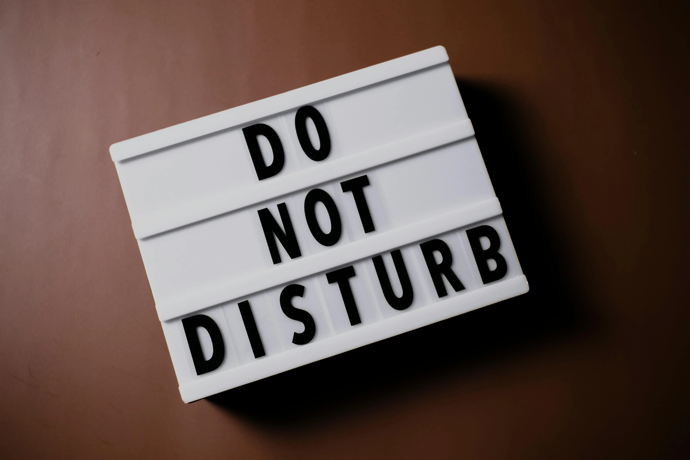 this is a close up image of a do not disturb sign