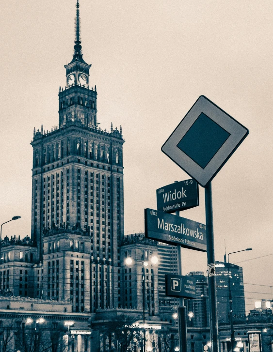 a large clock tower in the middle of a city