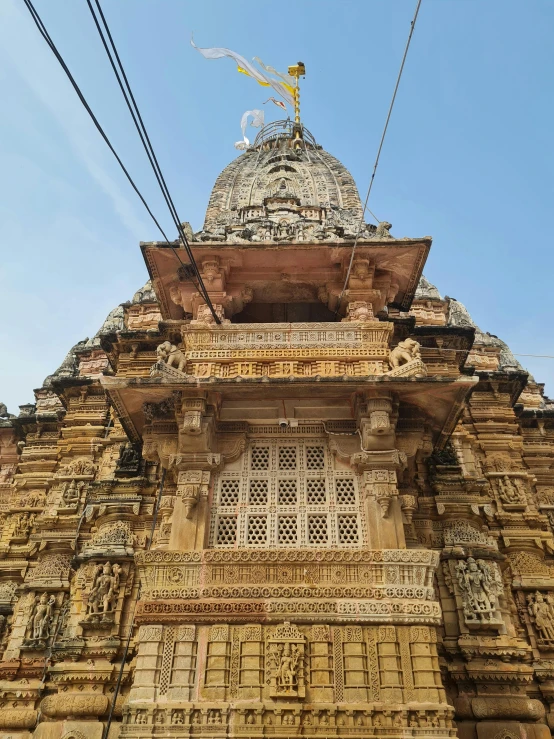 the tall tower is decorated with carved designs