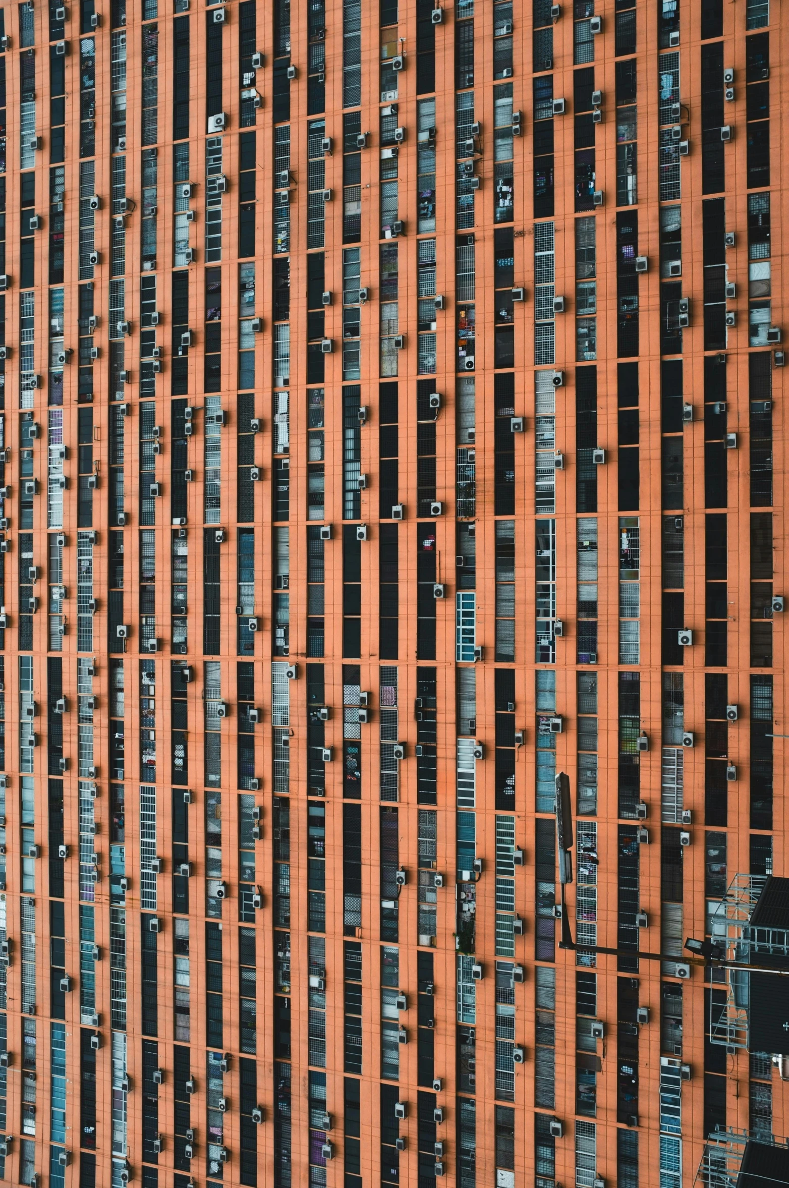 a large orange building with several parking spaces