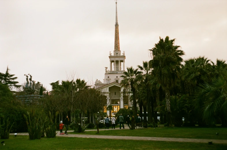 a tall white building with a tall spire