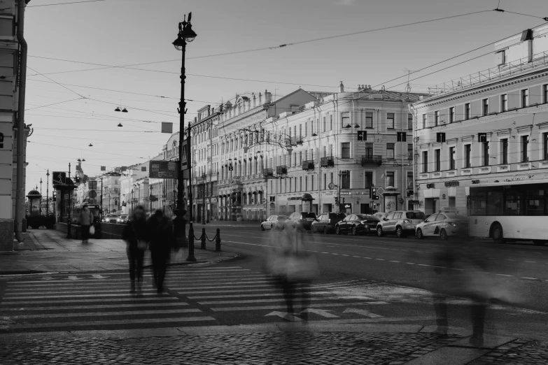 a city street with lots of people walking