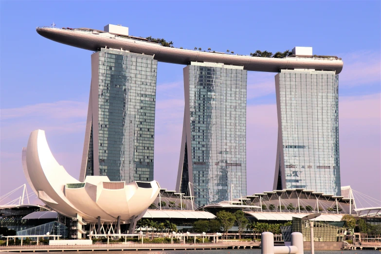 three large tall buildings towering over a city