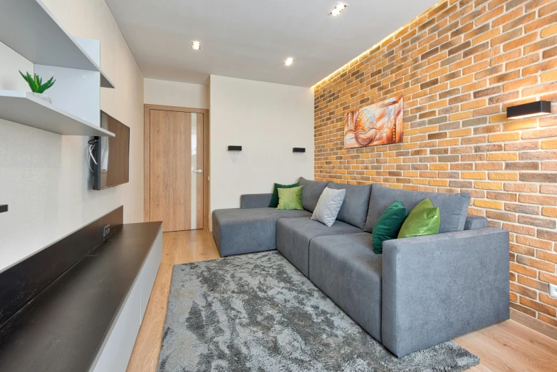 an interesting living room with a brick wall