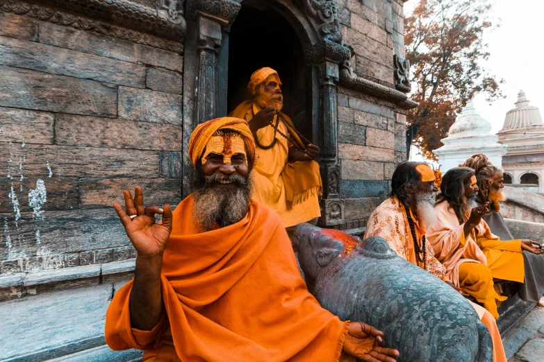 a group of men dressed as ancient indian deities