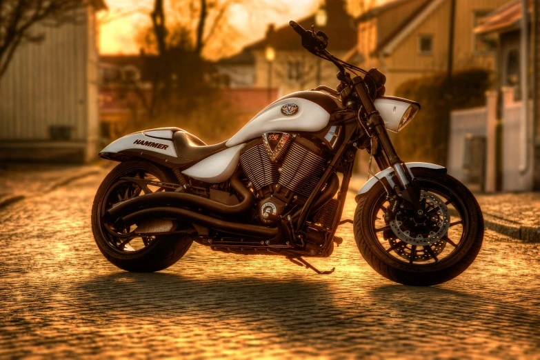 this motorcycle is parked on the street at dusk