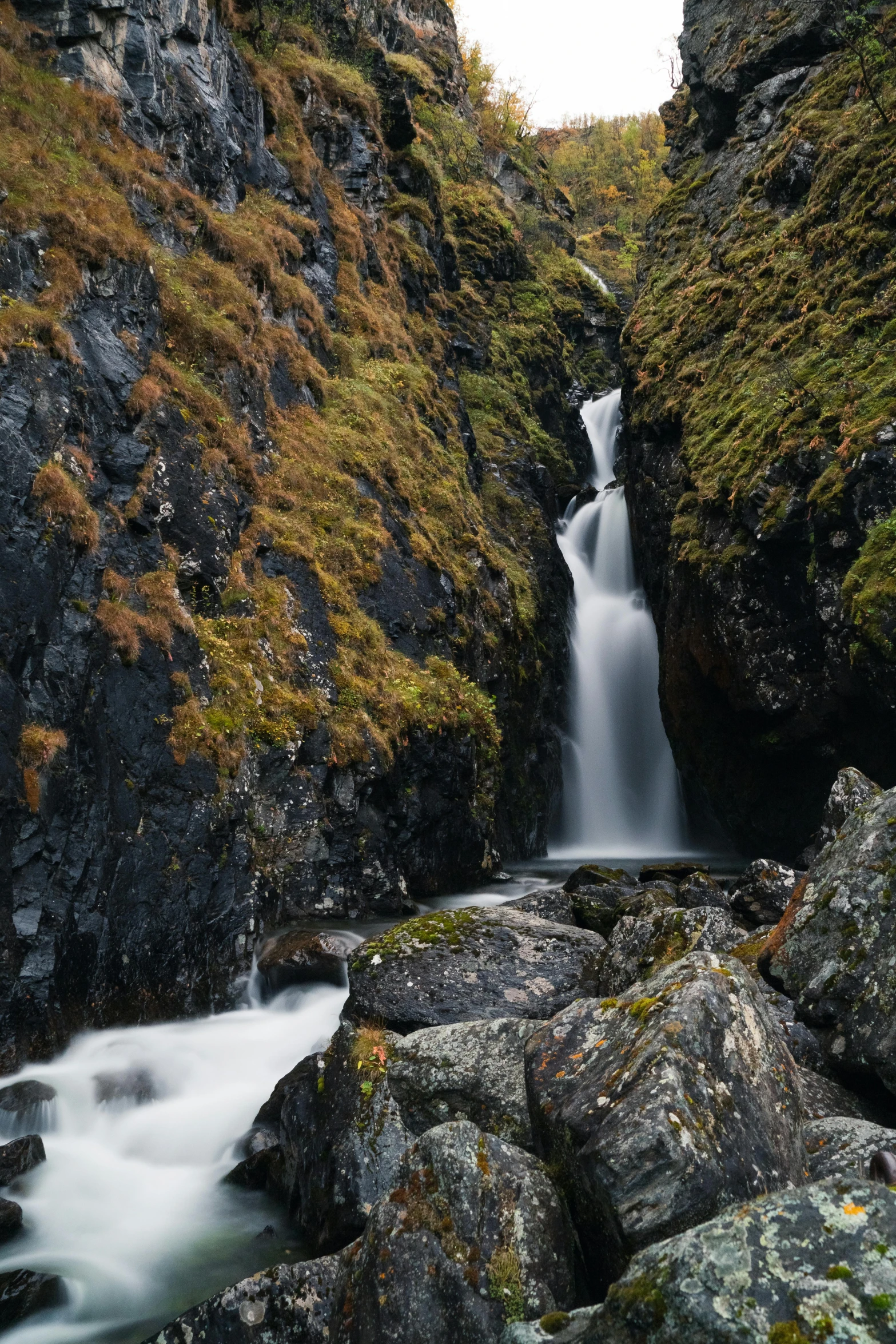 a long s of a waterfall with water