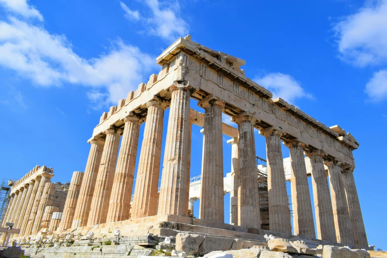 a tall stone structure with columns sitting on top