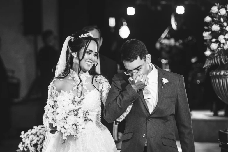 a couple walking down the aisle after a wedding ceremony